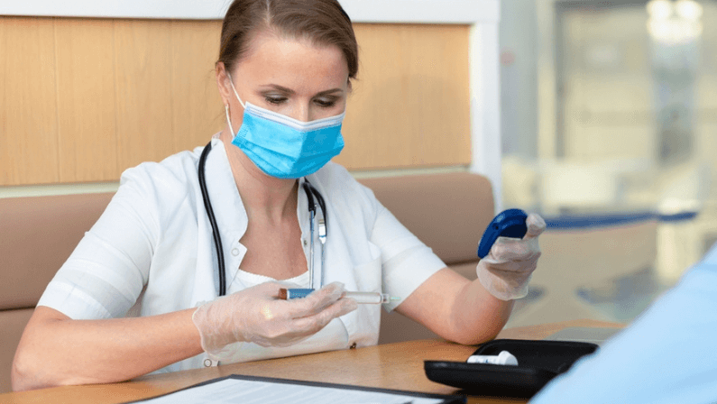 woman doctor pediartic looking at glucometer, checking the blood sugar level, prescribing dose of insulin, diabetes monitor. teenager male diabetic patient with female endocrinologist in hospital